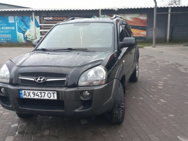 Черный Хендай Туксон, объемом двигателя 2 л и пробегом 200 тыс. км за 8300 $, фото 7 на Automoto.ua