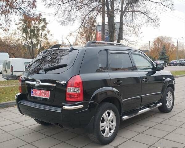 Черный Хендай Туксон, объемом двигателя 1.98 л и пробегом 214 тыс. км за 7700 $, фото 10 на Automoto.ua