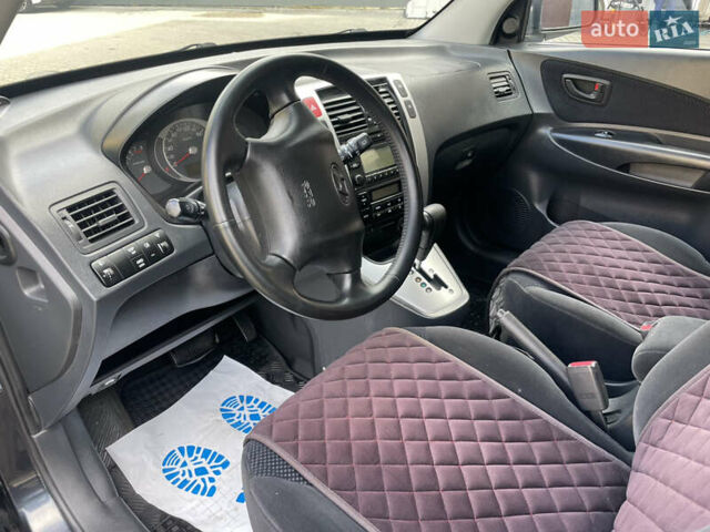 Черный Хендай Туксон, объемом двигателя 1.98 л и пробегом 177 тыс. км за 7600 $, фото 18 на Automoto.ua