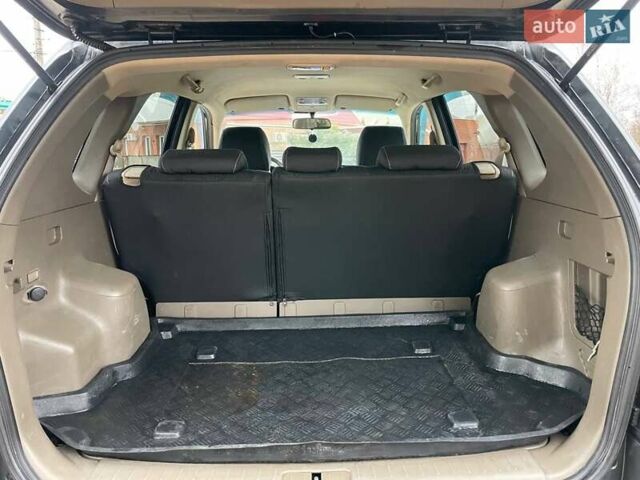 Черный Хендай Туксон, объемом двигателя 1.98 л и пробегом 290 тыс. км за 7000 $, фото 6 на Automoto.ua