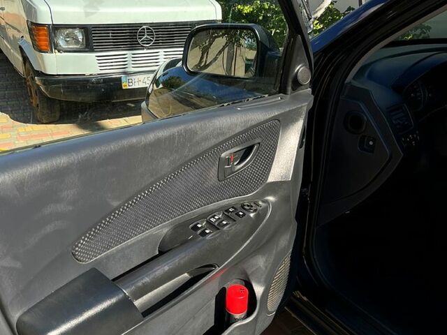 Черный Хендай Туксон, объемом двигателя 2 л и пробегом 151 тыс. км за 9000 $, фото 5 на Automoto.ua