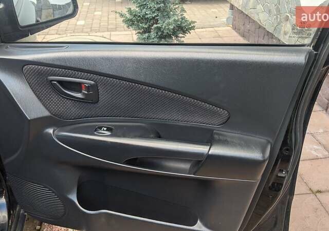Черный Хендай Туксон, объемом двигателя 2 л и пробегом 163 тыс. км за 8100 $, фото 12 на Automoto.ua