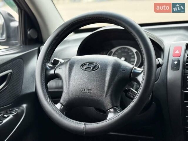 Черный Хендай Туксон, объемом двигателя 1.99 л и пробегом 240 тыс. км за 7200 $, фото 56 на Automoto.ua