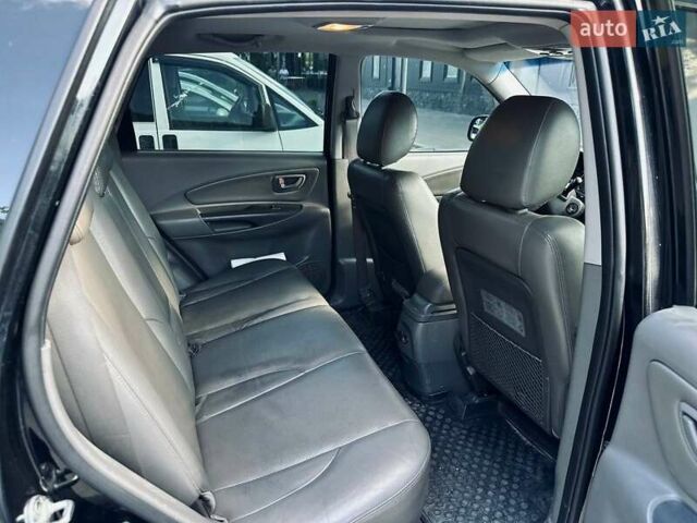 Черный Хендай Туксон, объемом двигателя 1.98 л и пробегом 206 тыс. км за 8300 $, фото 5 на Automoto.ua