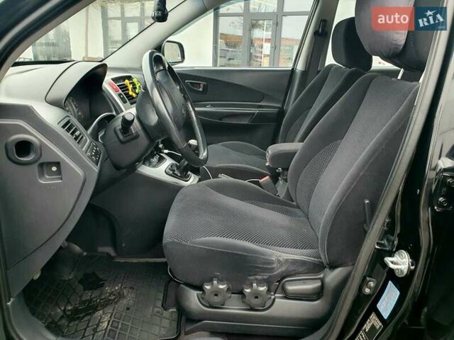 Чорний Хендай Туксон, об'ємом двигуна 2 л та пробігом 225 тис. км за 8000 $, фото 39 на Automoto.ua