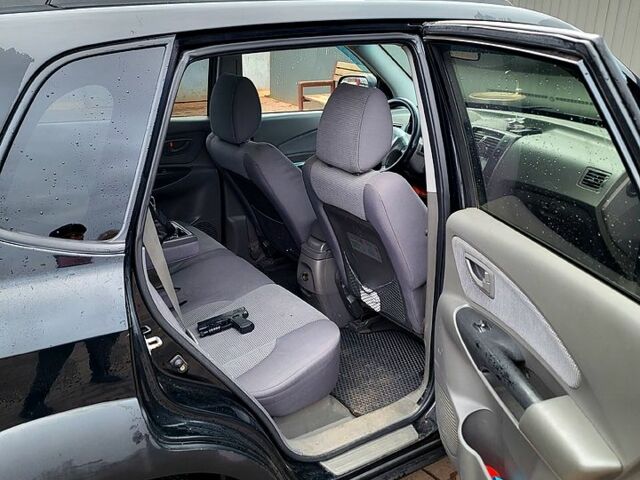 Черный Хендай Туксон, объемом двигателя 2 л и пробегом 223 тыс. км за 7500 $, фото 3 на Automoto.ua