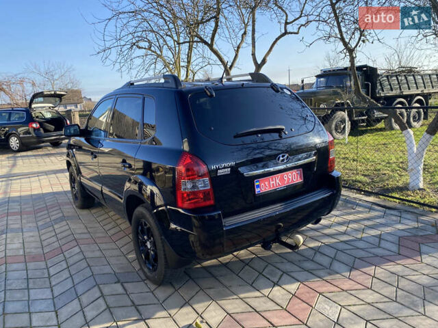 Черный Хендай Туксон, объемом двигателя 2 л и пробегом 149 тыс. км за 8250 $, фото 4 на Automoto.ua