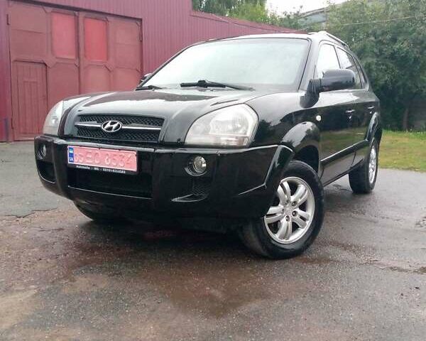 Чорний Хендай Туксон, об'ємом двигуна 2 л та пробігом 225 тис. км за 7850 $, фото 13 на Automoto.ua