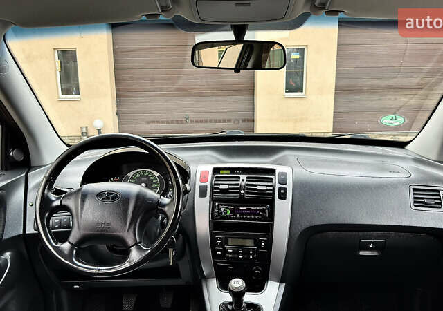 Чорний Хендай Туксон, об'ємом двигуна 2 л та пробігом 182 тис. км за 8299 $, фото 59 на Automoto.ua