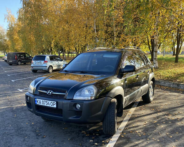 Черный Хендай Туксон, объемом двигателя 1.98 л и пробегом 218 тыс. км за 7200 $, фото 2 на Automoto.ua