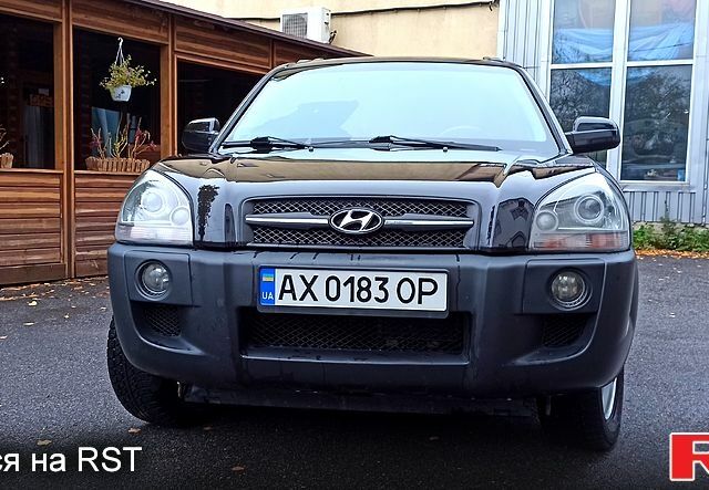 Чорний Хендай Туксон, об'ємом двигуна 2 л та пробігом 188 тис. км за 8800 $, фото 6 на Automoto.ua