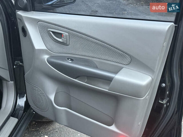 Чорний Хендай Туксон, об'ємом двигуна 2 л та пробігом 107 тис. км за 8500 $, фото 26 на Automoto.ua