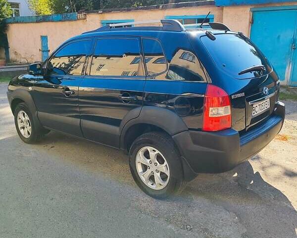 Черный Хендай Туксон, объемом двигателя 1.98 л и пробегом 330 тыс. км за 8200 $, фото 6 на Automoto.ua