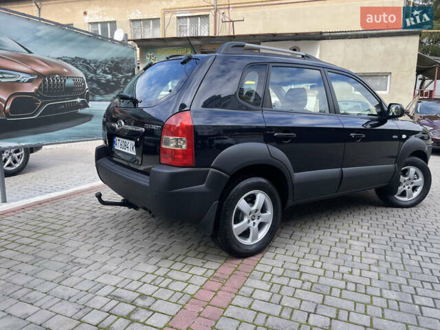 Черный Хендай Туксон, объемом двигателя 1.98 л и пробегом 177 тыс. км за 7600 $, фото 8 на Automoto.ua