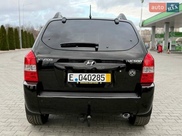 Черный Хендай Туксон, объемом двигателя 1.98 л и пробегом 239 тыс. км за 8700 $, фото 4 на Automoto.ua