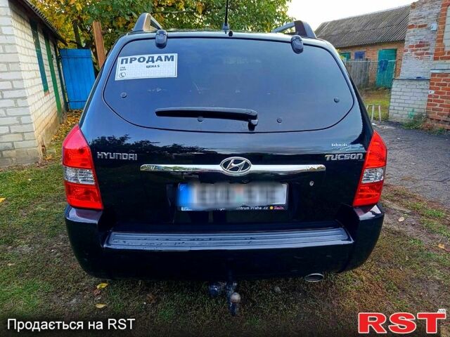 Черный Хендай Туксон, объемом двигателя 2 л и пробегом 187 тыс. км за 7900 $, фото 1 на Automoto.ua