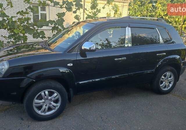 Черный Хендай Туксон, объемом двигателя 2 л и пробегом 215 тыс. км за 7999 $, фото 10 на Automoto.ua