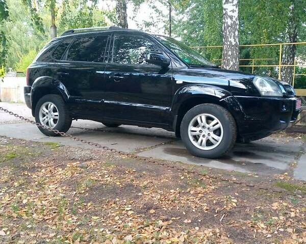 Черный Хендай Туксон, объемом двигателя 2 л и пробегом 224 тыс. км за 7900 $, фото 7 на Automoto.ua