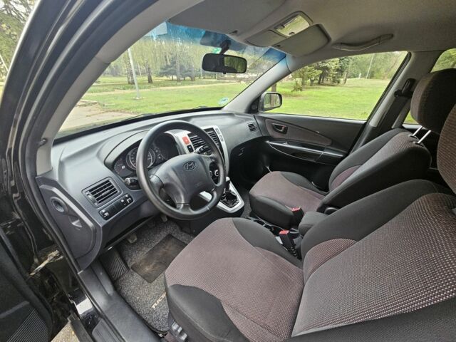 Чорний Хендай Туксон, об'ємом двигуна 2 л та пробігом 186 тис. км за 8300 $, фото 11 на Automoto.ua