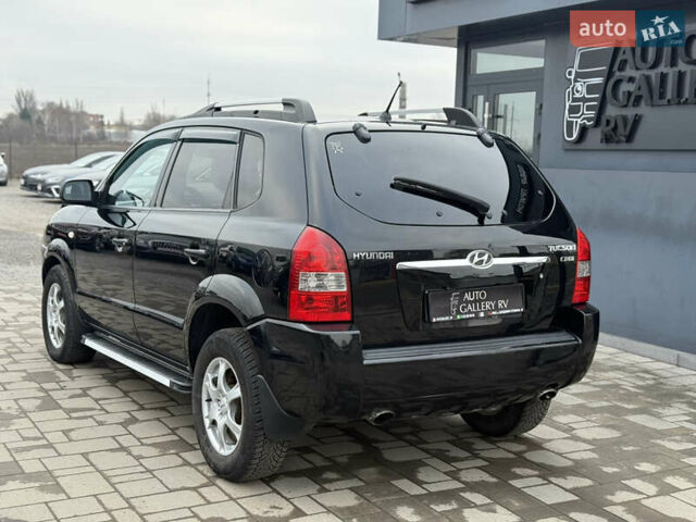 Чорний Хендай Туксон, об'ємом двигуна 2 л та пробігом 240 тис. км за 6888 $, фото 10 на Automoto.ua