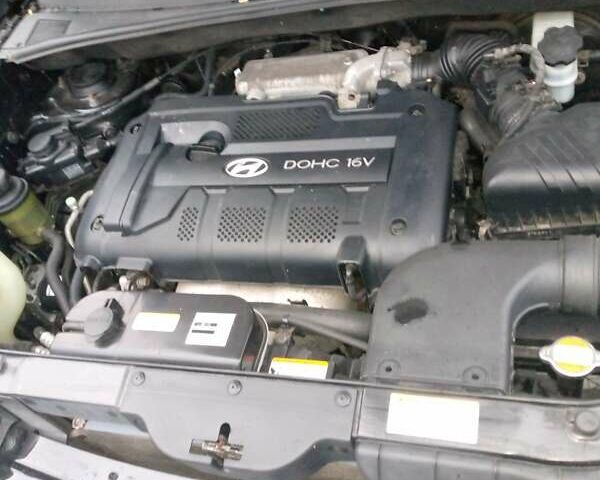 Чорний Хендай Туксон, об'ємом двигуна 2 л та пробігом 225 тис. км за 7850 $, фото 1 на Automoto.ua