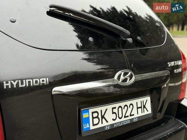 Черный Хендай Туксон, объемом двигателя 1.99 л и пробегом 240 тыс. км за 7200 $, фото 27 на Automoto.ua