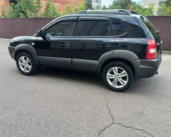 Черный Хендай Туксон, объемом двигателя 2 л и пробегом 168 тыс. км за 9000 $, фото 11 на Automoto.ua