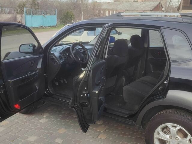 Чорний Хендай Туксон, об'ємом двигуна 2 л та пробігом 214 тис. км за 6000 $, фото 8 на Automoto.ua