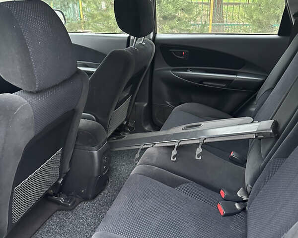 Черный Хендай Туксон, объемом двигателя 2 л и пробегом 136 тыс. км за 8500 $, фото 27 на Automoto.ua