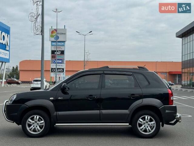 Черный Хендай Туксон, объемом двигателя 1.98 л и пробегом 202 тыс. км за 8350 $, фото 2 на Automoto.ua