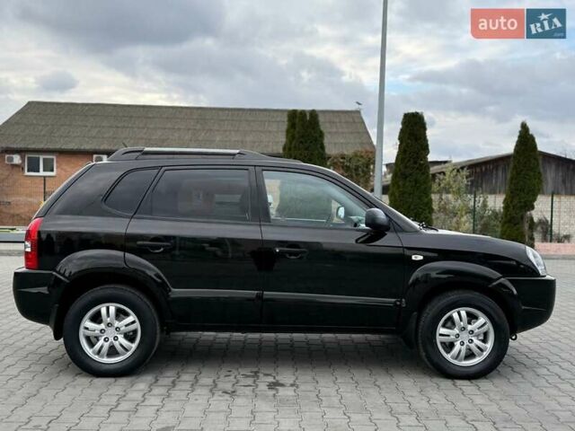 Черный Хендай Туксон, объемом двигателя 1.98 л и пробегом 239 тыс. км за 8700 $, фото 6 на Automoto.ua