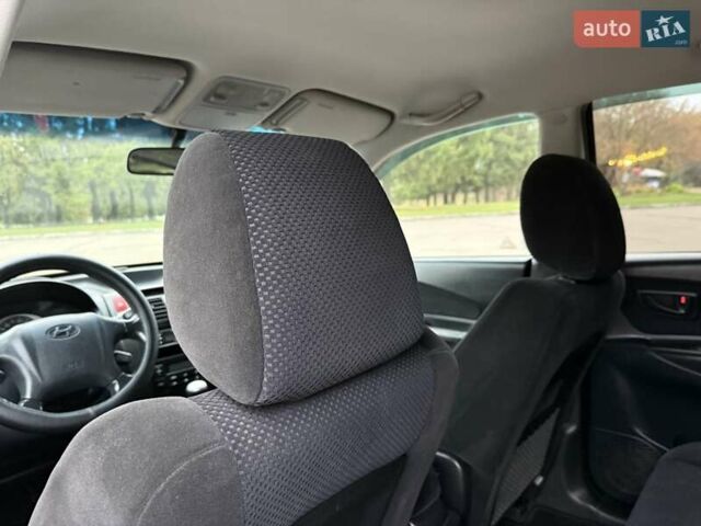 Черный Хендай Туксон, объемом двигателя 1.99 л и пробегом 240 тыс. км за 7200 $, фото 45 на Automoto.ua