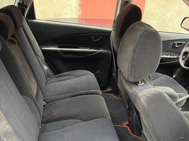 Черный Хендай Туксон, объемом двигателя 2 л и пробегом 270 тыс. км за 7600 $, фото 4 на Automoto.ua