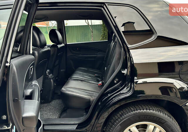 Чорний Хендай Туксон, об'ємом двигуна 2 л та пробігом 182 тис. км за 8299 $, фото 49 на Automoto.ua