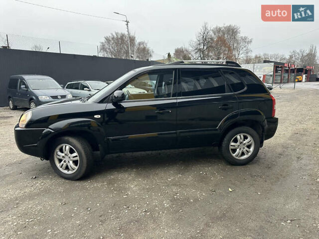 Чорний Хендай Туксон, об'ємом двигуна 2 л та пробігом 243 тис. км за 7999 $, фото 9 на Automoto.ua
