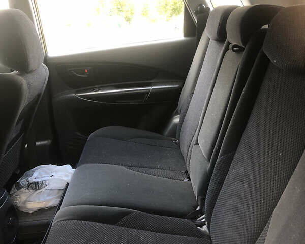 Черный Хендай Туксон, объемом двигателя 1.98 л и пробегом 256 тыс. км за 8200 $, фото 7 на Automoto.ua