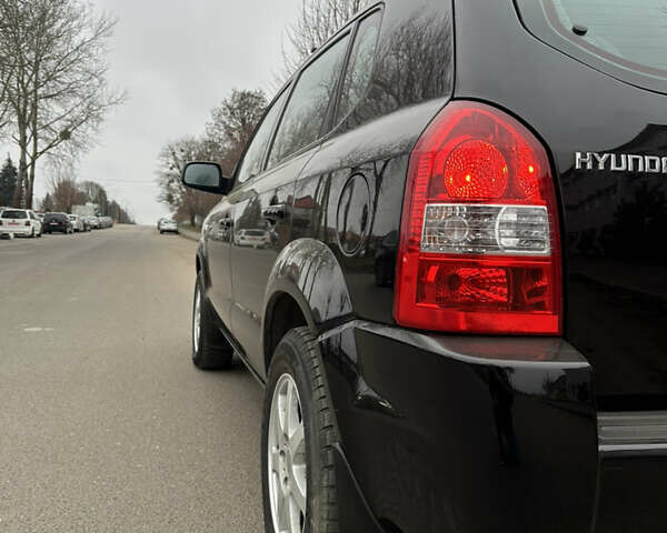 Черный Хендай Туксон, объемом двигателя 2 л и пробегом 136 тыс. км за 8500 $, фото 7 на Automoto.ua