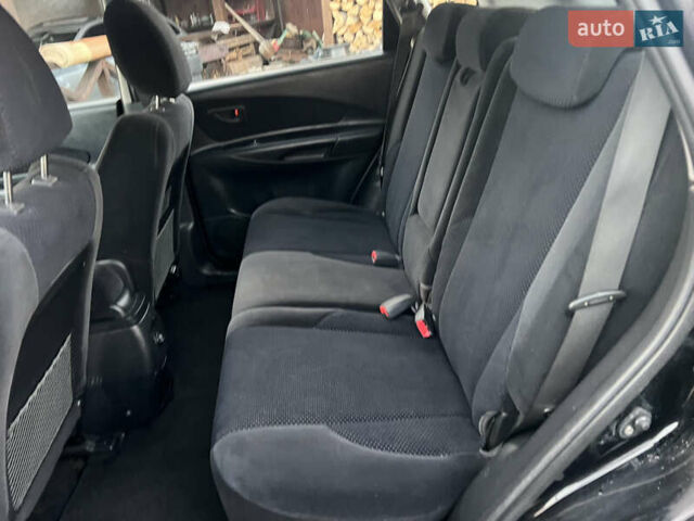 Черный Хендай Туксон, объемом двигателя 2 л и пробегом 276 тыс. км за 7450 $, фото 26 на Automoto.ua