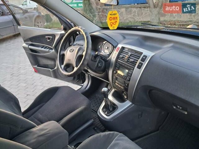 Черный Хендай Туксон, объемом двигателя 1.98 л и пробегом 233 тыс. км за 7850 $, фото 14 на Automoto.ua