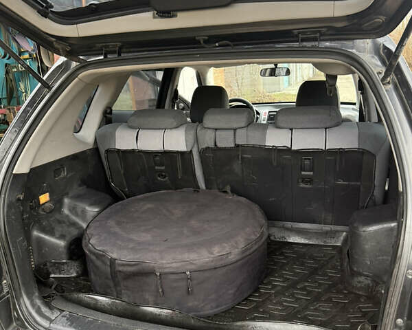 Черный Хендай Туксон, объемом двигателя 1.98 л и пробегом 220 тыс. км за 7500 $, фото 21 на Automoto.ua