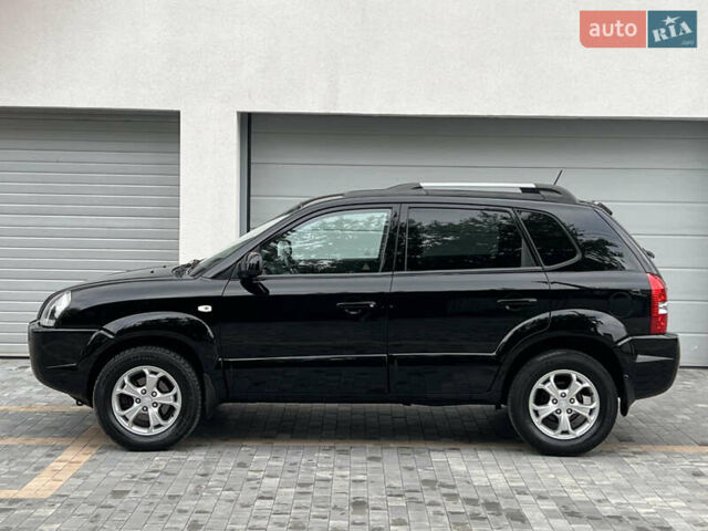 Чорний Хендай Туксон, об'ємом двигуна 2 л та пробігом 163 тис. км за 9199 $, фото 12 на Automoto.ua
