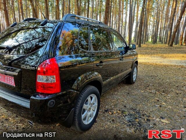 Черный Хендай Туксон, объемом двигателя 2 л и пробегом 204 тыс. км за 8900 $, фото 4 на Automoto.ua