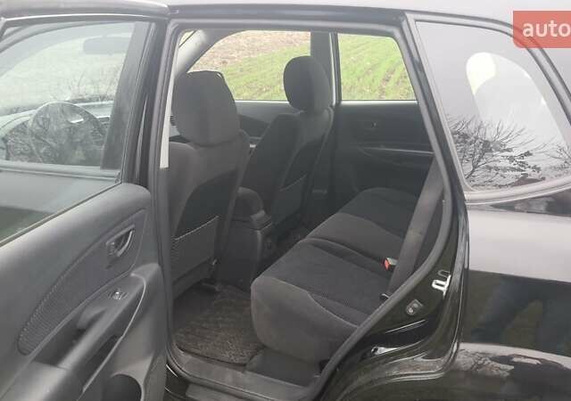 Черный Хендай Туксон, объемом двигателя 2 л и пробегом 198 тыс. км за 8200 $, фото 6 на Automoto.ua