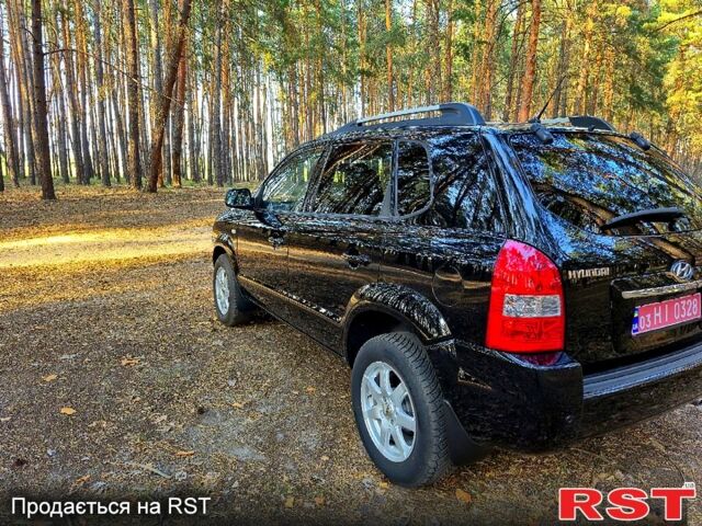 Черный Хендай Туксон, объемом двигателя 2 л и пробегом 204 тыс. км за 8900 $, фото 3 на Automoto.ua