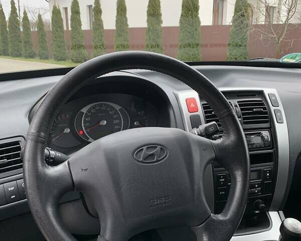 Черный Хендай Туксон, объемом двигателя 2 л и пробегом 114 тыс. км за 8850 $, фото 38 на Automoto.ua