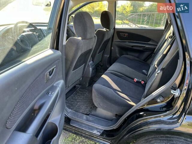 Черный Хендай Туксон, объемом двигателя 2 л и пробегом 198 тыс. км за 8200 $, фото 16 на Automoto.ua