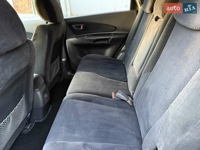 Черный Хендай Туксон, объемом двигателя 2 л и пробегом 148 тыс. км за 8700 $, фото 15 на Automoto.ua