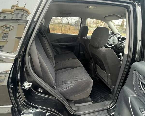 Черный Хендай Туксон, объемом двигателя 2 л и пробегом 128 тыс. км за 9200 $, фото 8 на Automoto.ua