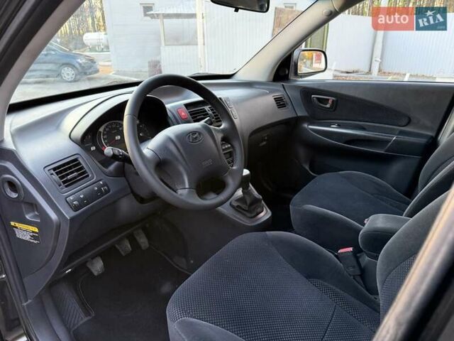 Черный Хендай Туксон, объемом двигателя 2 л и пробегом 148 тыс. км за 8700 $, фото 12 на Automoto.ua