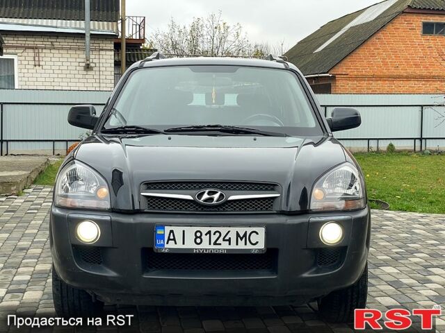 Чорний Хендай Туксон, об'ємом двигуна 2 л та пробігом 200 тис. км за 8499 $, фото 4 на Automoto.ua